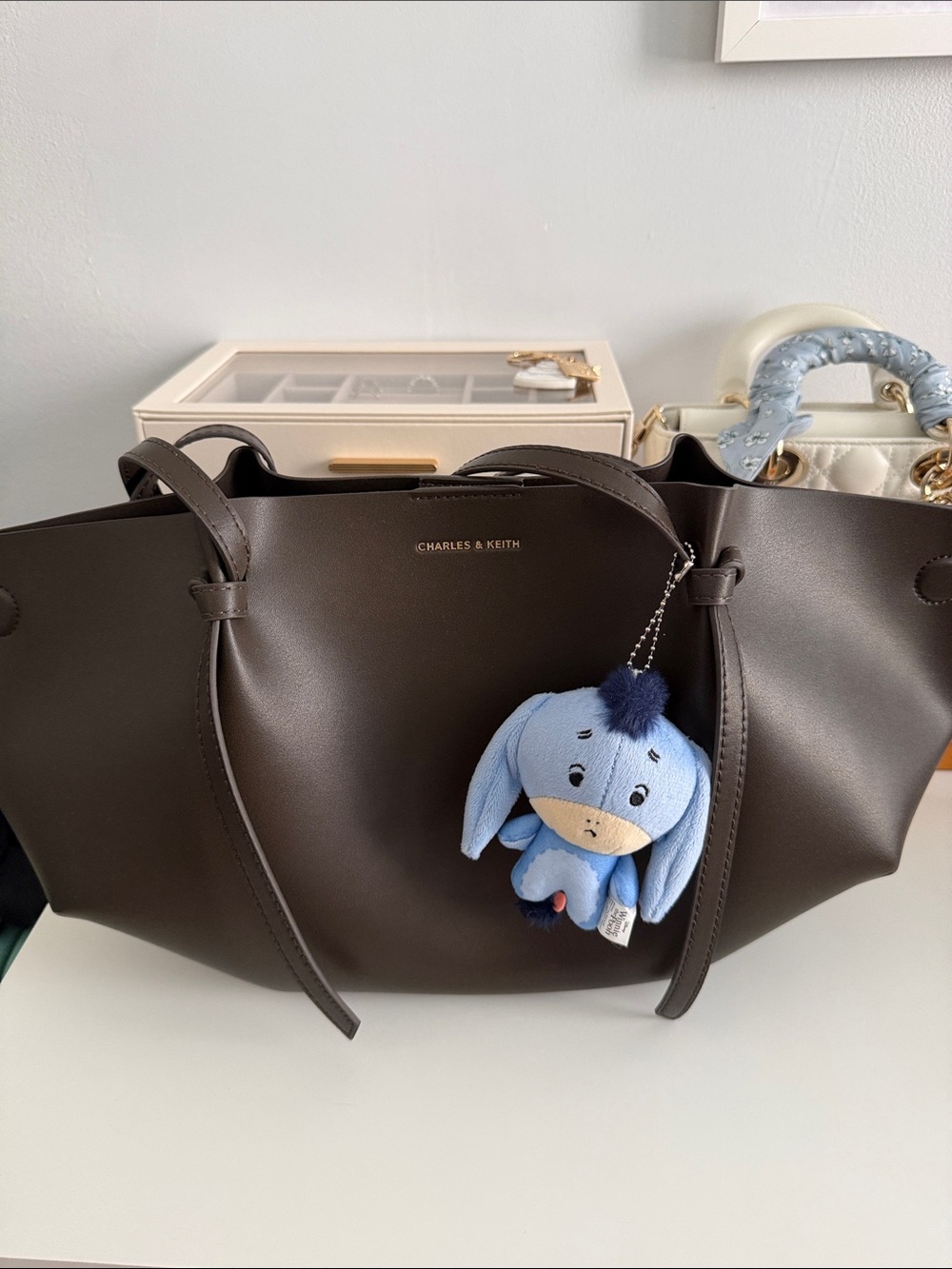 CHARLES & KEITH Chocolate Brown Tote Bag with Blue Plush Charm
